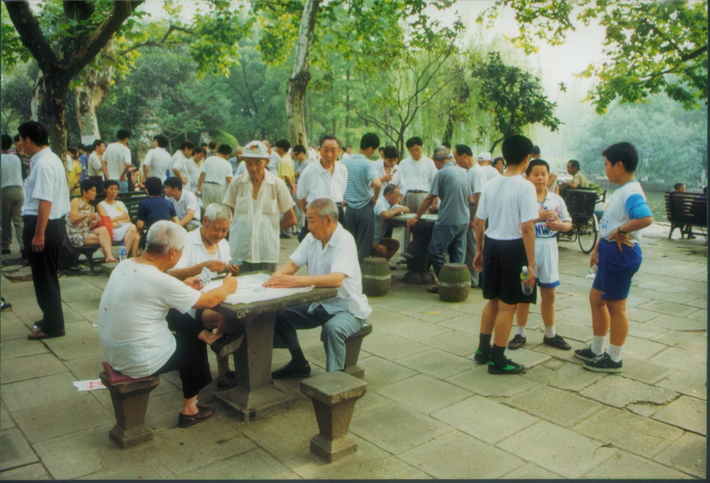 men playing cards in park  china 1999