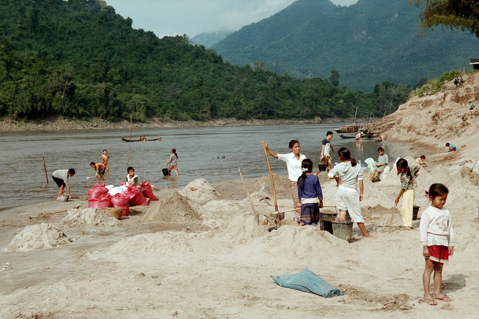 Gathering sand at the Mekong river , Luang Prabang Laos  -  Mar 2003