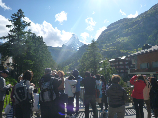 tourists photograph matterhorn mountain from zermatt switzerland aug 2014